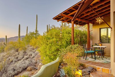Latilla covered patio with saltillo floors and a Mexican star lantern overlooking a saguaro-studded hill in Cave Creek 