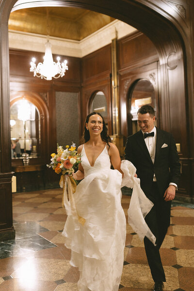 Wedding couple walking through the Fairmont Palliser in Calgary