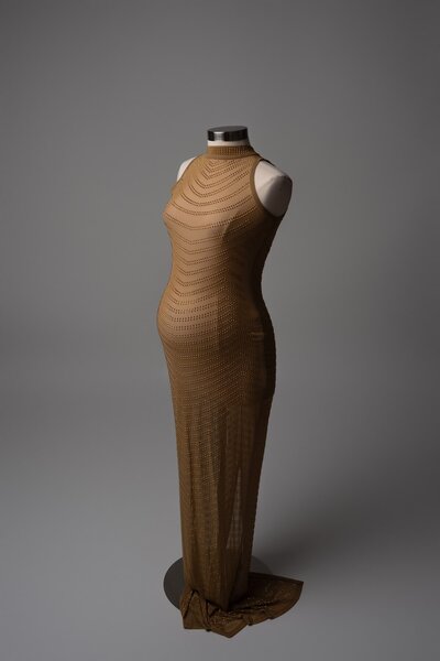 Metallic bronze fitted gown, studio maternity wardrobe photographed on mannequin