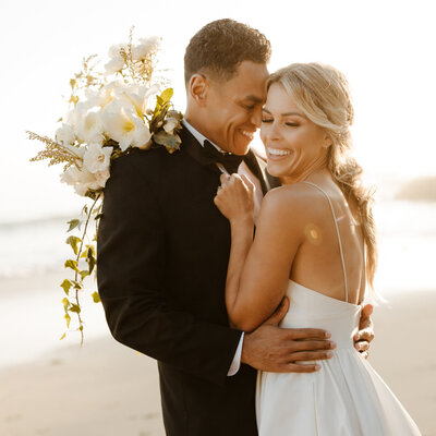 Bride and groom laughing together at Southern California elopement