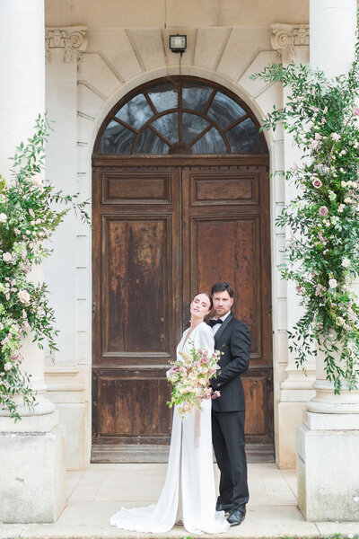 Bride and groom walk up memorial steps at their DC wedding