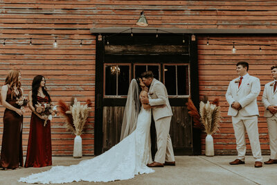 Married couple kissing each other
