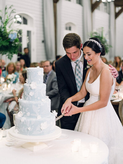 Bride and Groom cuts cake at reception in Atlanta