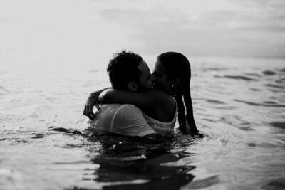 couple kissing in water