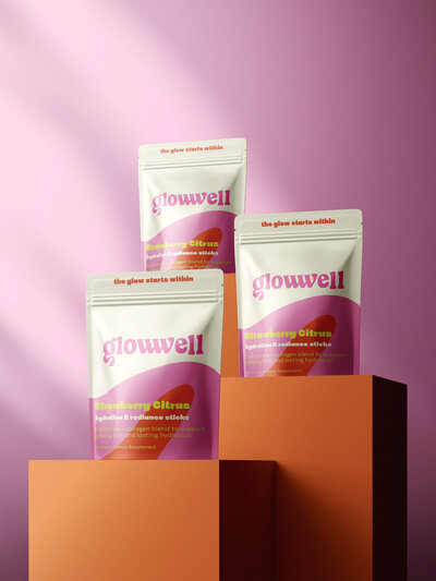 Modern feminine supplement branding with pink packaging and clean typography — Glowwell CPG design for beauty wellness products.