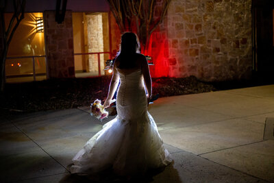 bride lit by motorcycle headlight