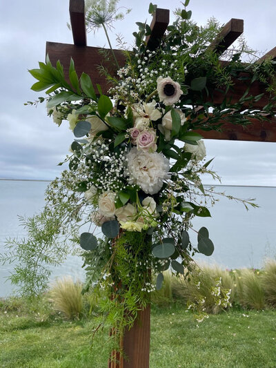 Florals in wedding ceremony arch