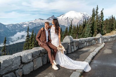 Happy elopement couple with Mount Rainier and a forest as a backdrop