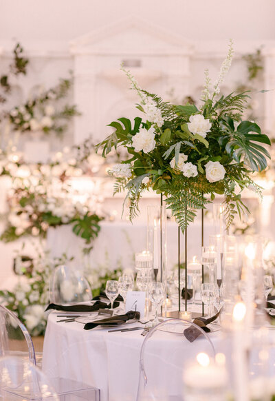 An exotic, elevated garden centrepiece on a table with candles at Maison Principale.