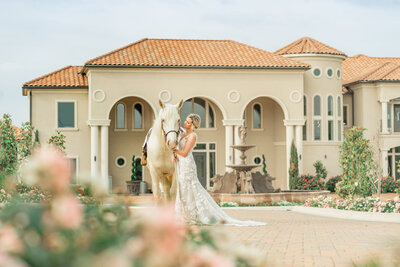 Bride posing with her horse in Austin Texas.