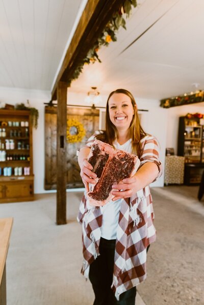 Person holding premium rare steak