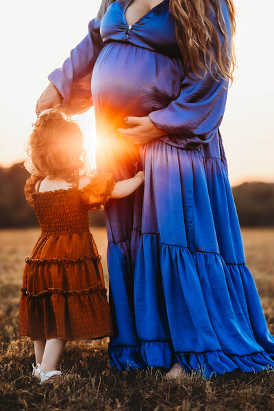 Golden sunset photo of pregnant mom and daughter in Harrisburg, PA