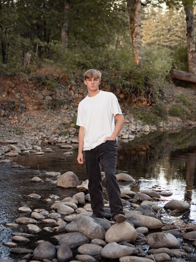 Boy standing in river bed at Milo Mciver Park in Estacada, Oregon