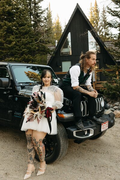 Two Brides enjoy a hot tub while a colorado wedding photographer takes their picture.
