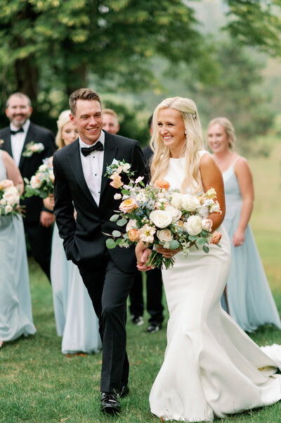 reception details including table numbers, flowers, and bright napkins at minneapolis wedding