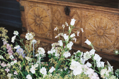 film photo of white and neutral wedding florals