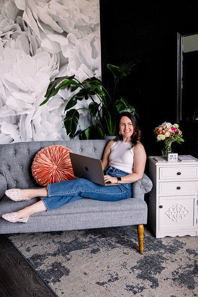 Stephanie Seija Content Marketing - woman sitting on couch with laptop providing content marketing services