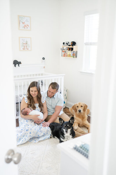 Mom looking at baby taken by Apex Newborn Photographer
