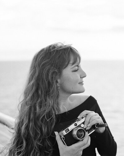 Candid, natural black and white portrait of Christina Harrison, Destination and Michigan film wedding photographer