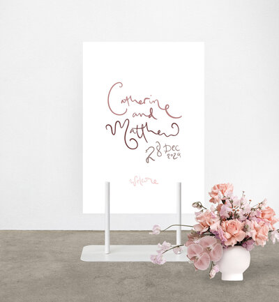 Modern script style welcome sign in blush dusty rose print on peg stand to hire from State of Elliott