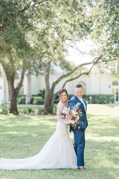 bridal couple walking outside of chapel