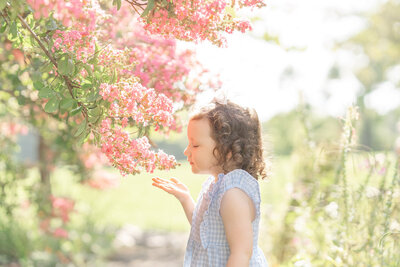 girl smelling the flowers in Chantilly, Virginia