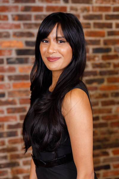 wedding planner in Tennessee standing in front of a brick wall
