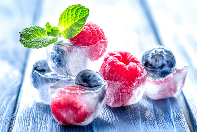 ice cold raspberries and blueberries