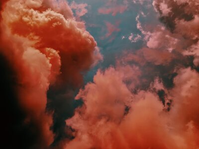 Pink and orange clouds at sunset over a blue sky