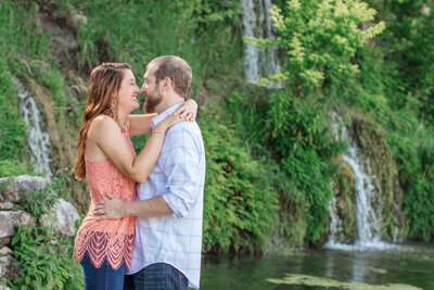 engagement portrait lace peach top waterfall green foliage Remi's Ridge Hidden Falls in Spring Branch Texas by Firefly Photography