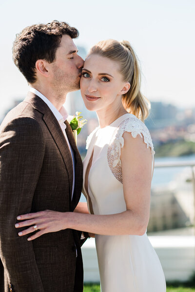 bride and groom portrait on rooftop in Boston