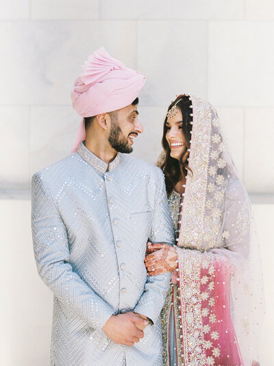 Nikah photo of couple in red outfits