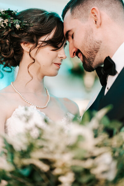 An intimate moment at their Bedell Cellars wedding in  Cutchogue, New York