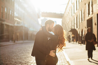 Couple dressed up as they embrace during NYC Engagement Session