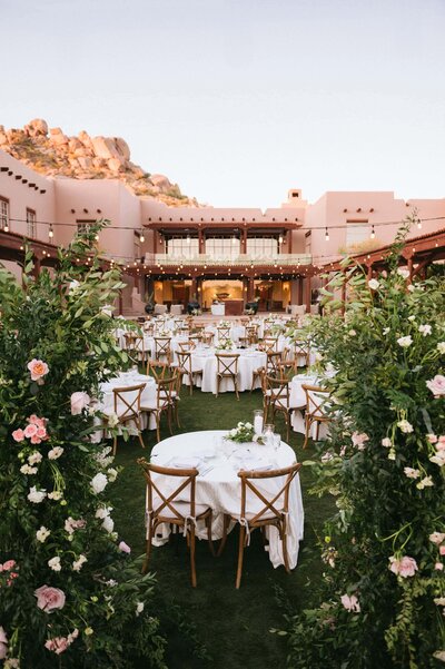 Four Seasons Scottsdale wedding reception under string lights with elegant tables and desert views at the Troon North wedding venue.