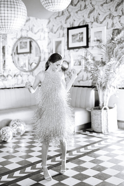 woman dancing in fringe dress