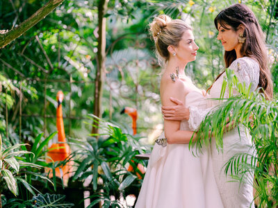 Two brides hold each other at their Key West wedding