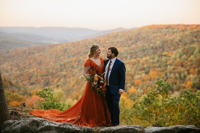 Couple in the Tennessee mountains during warm, fall elopement