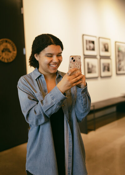 Catryce Taking a Photo in a Room