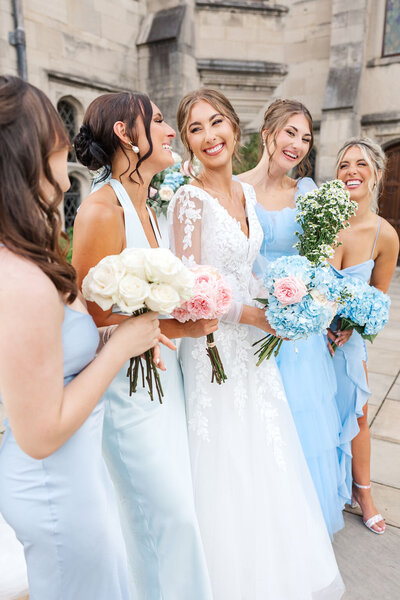 Photo of  bride smiling at her girls.