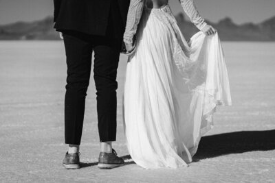 Detail shot of wedding attire on the Bonneville Salt Flats in Utah.