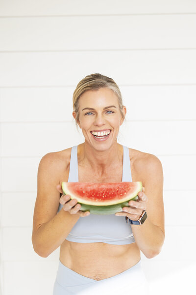 Katie Appleby enjoying a nutritious, balanced meal, showcasing how personalized nutrition coaching supports a healthy lifestyle.