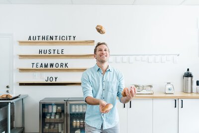 Crieve Hall Branding Photos of owner juggling bagels by Nashville Branding Photographer Dolly DeLong Photography