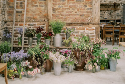Vases of flowers await a floral workshop.