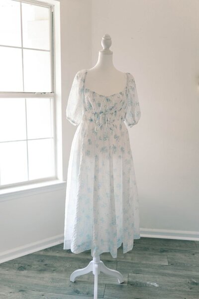 Women's white and blue floral dress.