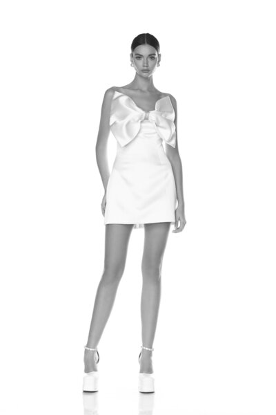 black and white image bride wearing strapless satin wedding dress with long train
