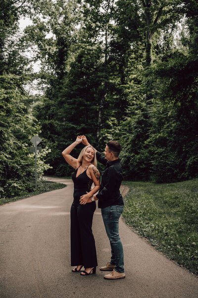 couple dancing on Michigan tree lined pathway
