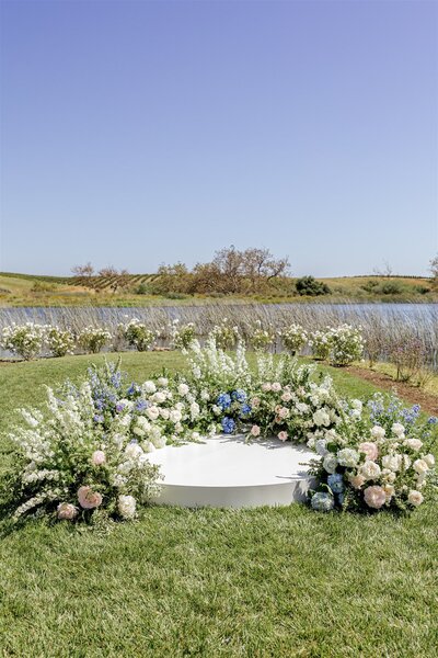 Grounded arch, wedding ceremony La Lomita Ranch, San Luis Obispo Wedding Flowers, Precious and blooming, round stage for wedding ceremony, Floral design greengate ranch