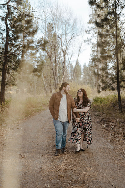 engagement couple walking in lake tahoe