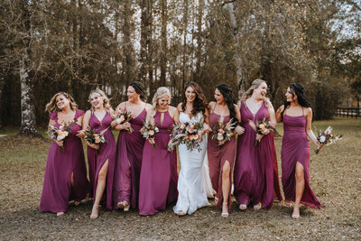 bride standing with her bridesmaids